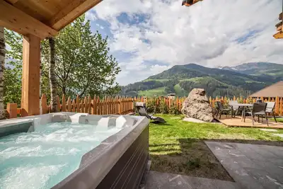 Image de Chalet \"Heidi und Peter\" avec vue sur les montagnes, sauna, bain à remous, jardin et Wi-Fi
