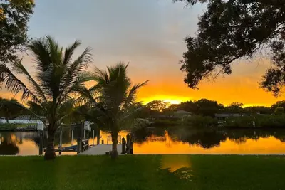 Unique tropical waterfront paradise with private dock, fast WiFi, & large yard