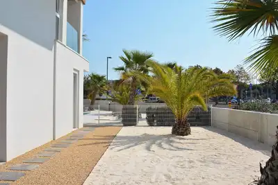 Image de Apartment with Pool and a spacious patio with sand