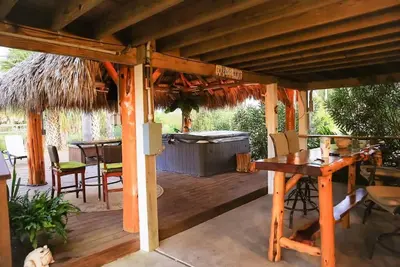 Private Hot Tub with outdoor shower and tiki area to relax and Enjoy!