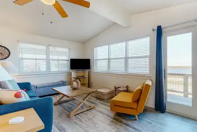 Dog-friendly, waterfront getaway with a pool, WiFi, central A/C, & washer/dryer