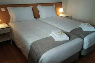 Image de Central Suites Arouca com estacionamento gratuito