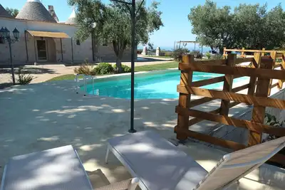 Image de Panoramic trulli for 7 people in the hills with exclusive swimming pool 8 km from the sea