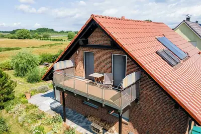 Image de Modern vacation apartment with side water view, balcony, sauna and fireplace