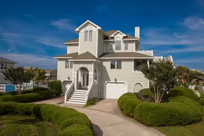 Image de Revival-style canalfront home with private pool, two docks, beach access & views