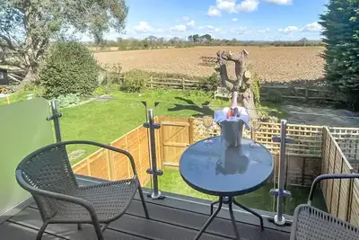 Image de Set in a tranquil location with a balcony overlooking the fields and countryside.