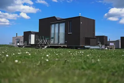Image de Sustainable overnight experience in the Green Tiny House Nature on the North Sea