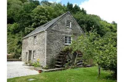 Image de Beautiful converted watermill in a secluded river valley near the sea