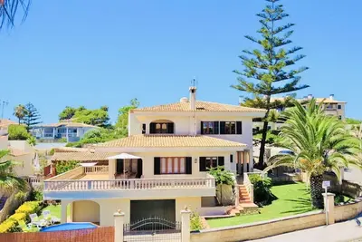 Image de *****Villa de MĂłn with sea access, pool and close to the beach