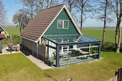 Image de Luxuriöses Ferienhaus mit Terrassenüberdachung, Wlan, Gemeinschaftspool, E-Bikes