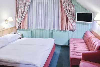 Image de Familienzimmer Woid Haus, 24 m² - Kinderhotel Stegerhof