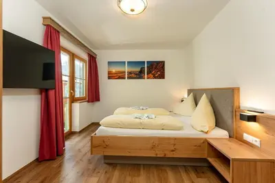 Image de Suite - Holiday apartment Bergidyll - Irxnerhof - Vacation on a farm