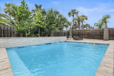 Image de Heated optional pool and directly across the street from a private beach access!