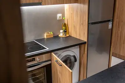 Image de Cozy modern apartment a few minutes from Mades beach.