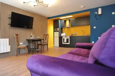 A ground floor studio flat with either double or twin beds, fully equipped kitchen + parking