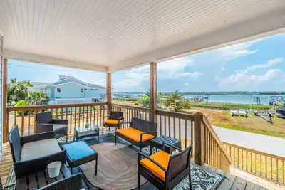 Image de Sunset | Covered Porch + Walk to the Beach!