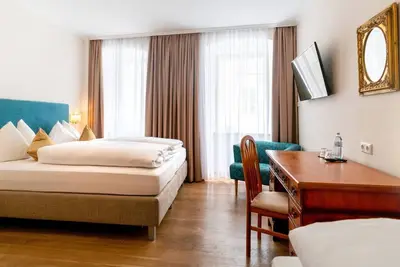 Image de Triple room - non refundable rate - Hotel Trumer Stube