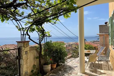Image de Terrace with stunning sea view and pergola with vines