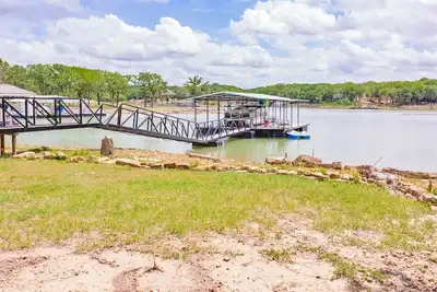 Family lake front home with dock, kayak, outdoor kitchen and more