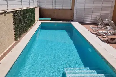 Image de Semi-detached house 150 meters from the beach with private pool