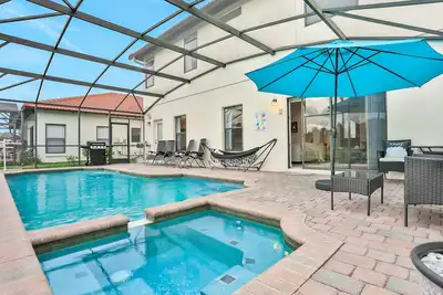 Image de Stunning home with water view, pool, game room, fitness area & washer/dryer