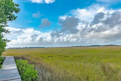 Image de As you enter, the Bald Head Creek and marsh vistas-through the walls of windows-catch your eye.