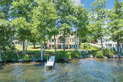 Image de Modern Lake Opechee Home features Sandy Perched Beach and Dock