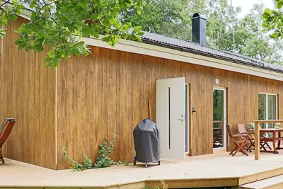 Image de Maison de vacances pour 4 a KNÄRED-By Traum