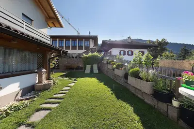 Image de Appartement Panorama avec vue sur les montagnes, jardin et Wi-Fi.