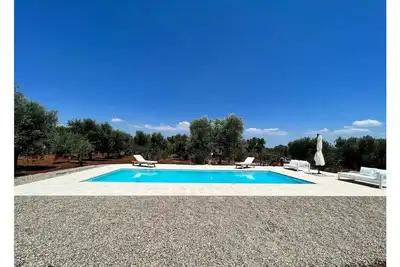 Image de Modern trulli with a beautiful pool.