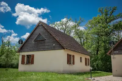 Image de Maison dans un parc de vacances avec piscine