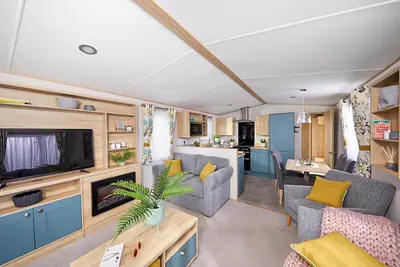 Spacious and modern 12ft-wide caravan with one double and two twin.