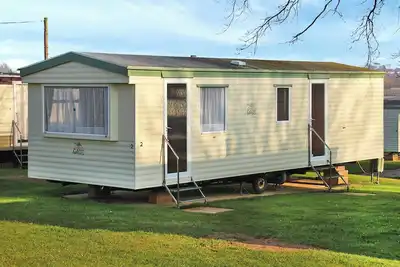 Image de Cosy caravan with one double and one twin.