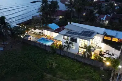 Image de A beach house (shared space) and a romantic place during sunset!