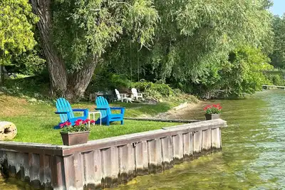 Image de Direct Lake Leelanau Sunset view, Fire pit, grill, dock, boat lift, dog ok