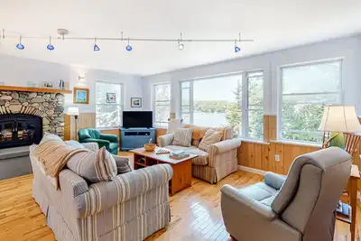 Secluded waterfront home with firepit, gas grill, kayaks, dock, balcony, & patio