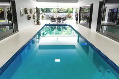 Luxury Tropical Escape: Beachside Villa with Heated Pool & Modern Comforts