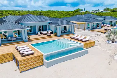 Image de Luxury beachfront villa with dock and a private large heated pool. For 10 people