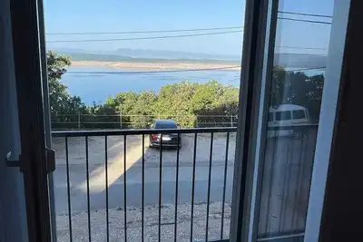 Image de Appartement de vacances avec air conditionné et vue sur la mer