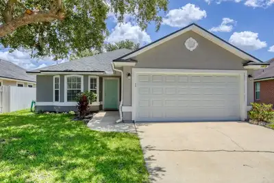 Image de Single-story home with lagoon view, garden patio & easy drive to the beach