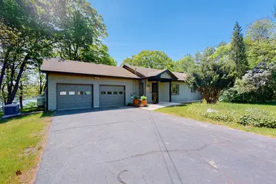 Water-view retreat with beach access, deck, grill, Ev charger & lawn games