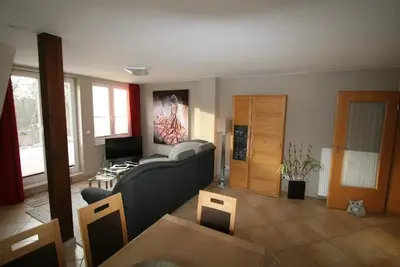 Image de Bright, modern apartment with fireplace and secluded roof terrace, close to the beach