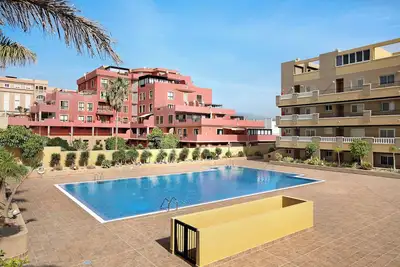 Image de Appartement de vacances 'La Perla F14 En El Médano' avec piscine partagée, balcon et Wi-Fi