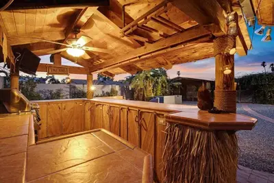 Cheerful Home with Amazing Tiki Themed Backyard