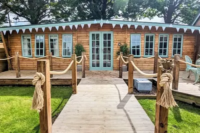 Elegantly finished lodge with a private, decked garden.