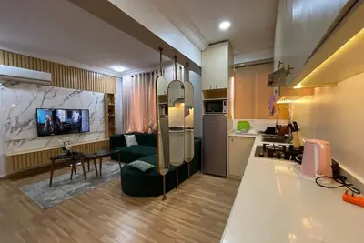 Luxe 1 bedroom apartment with pool and gym, 10 mins from the beach
