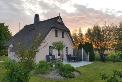 Image de Coziness under thatch, fireplace, sun terrace
