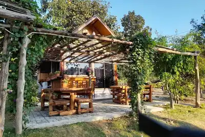 Image de A Bungalow with attached kitchen in rural environment