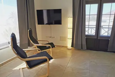 Image de Appartement d’une chambre lit double, balcon et vue sur la mer dans le Tahiche.