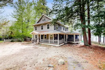 Image de Captivating waterfront home with private dock & beach, lake views